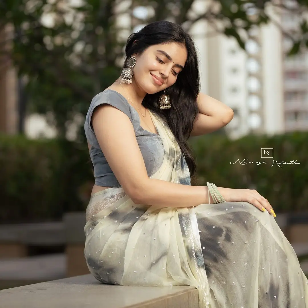 Navya Marouthu Wearing White Saree Sleeveless Black Blouse